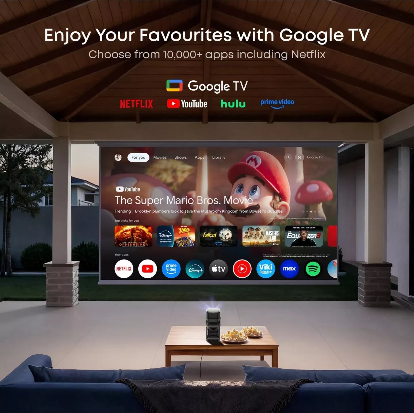 Nebula P1 showing the Google TV home screen in a garden